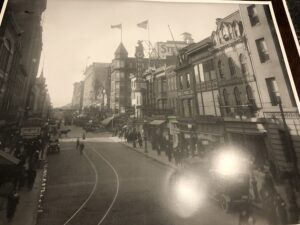 A black and white photo of an old city street.