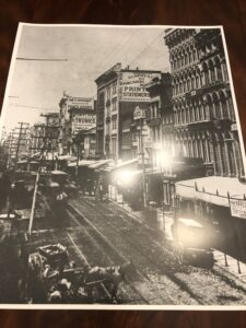 A black and white photo of an old city street.