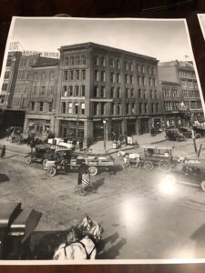 A black and white photo of an old city street.