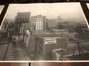 A black and white photo of buildings in the city.