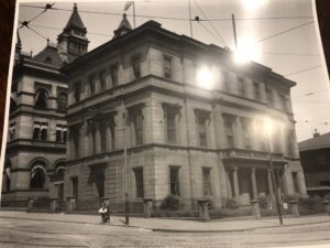 A black and white photo of an old building.
