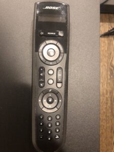 A remote control is shown on the wall.