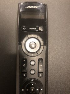 A remote control sitting on top of a table.