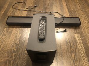 A remote control sitting on top of a box.