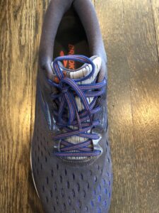 A close up of the laces on a pair of shoes