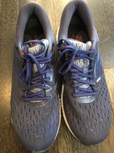 A pair of shoes sitting on top of the floor.