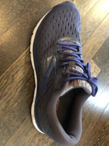 A close up of the shoe on the floor