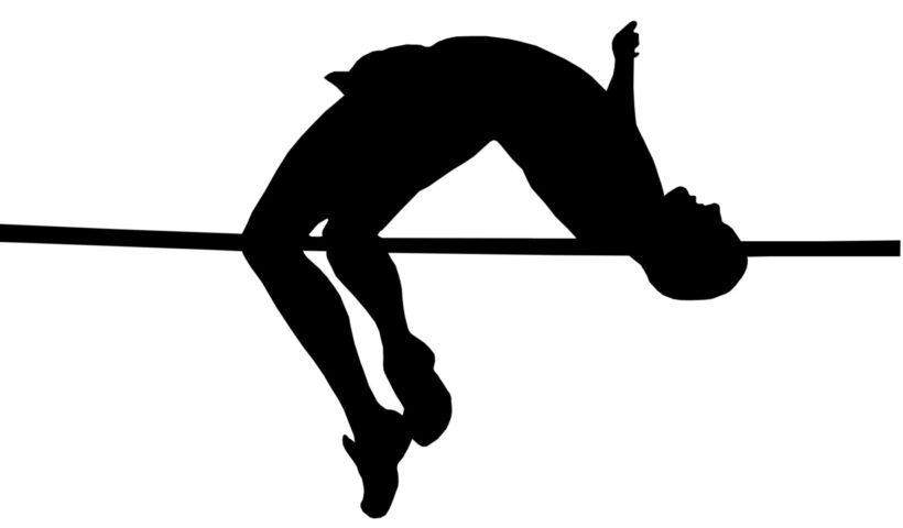 A man jumping over the bar on a high jump.