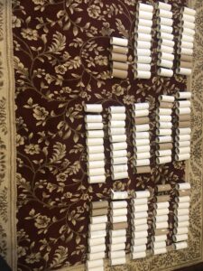 A wall with many rolls of toilet paper on it