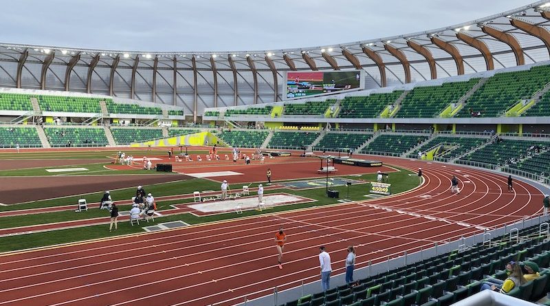 A large stadium with many people on it