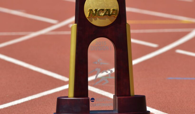 A trophy sitting on top of an athletic field.