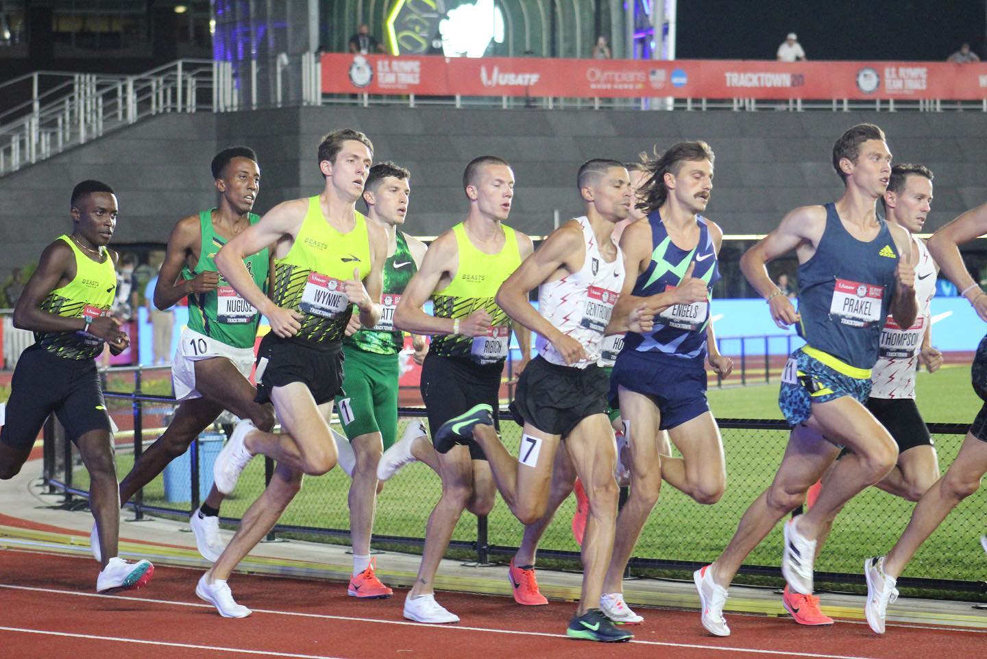 A group of men running on the track