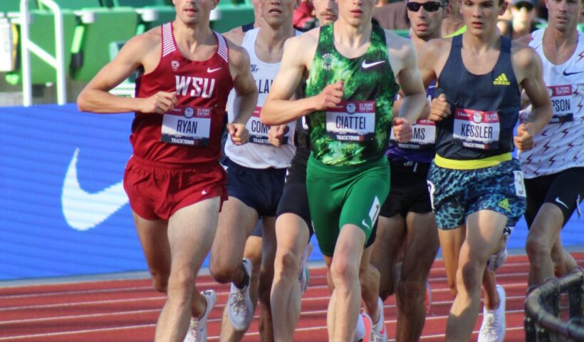 A group of men running on a track