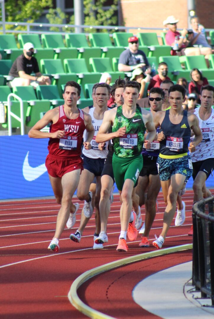 A group of men running on a track