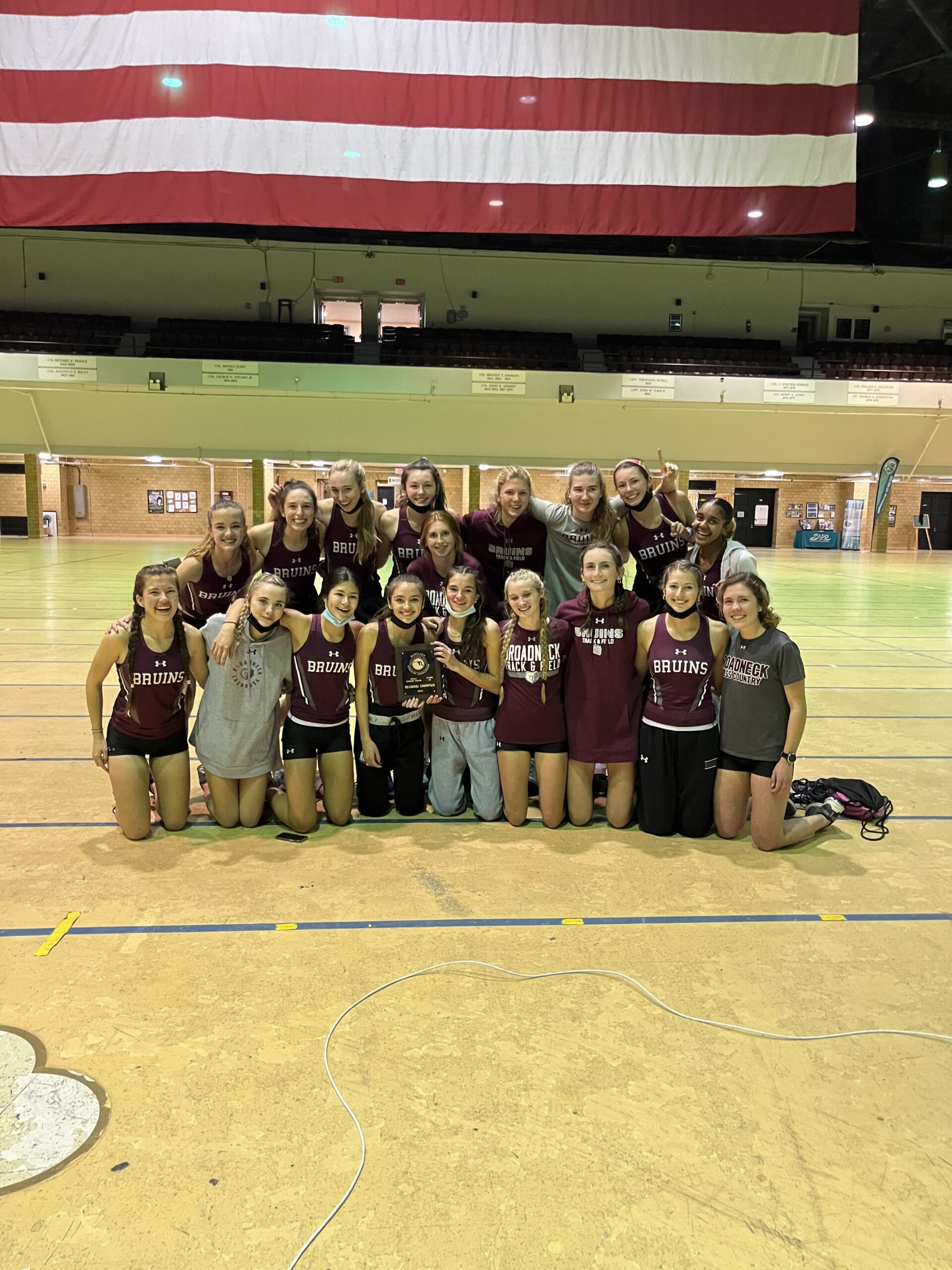 A group of girls standing in front of each other.