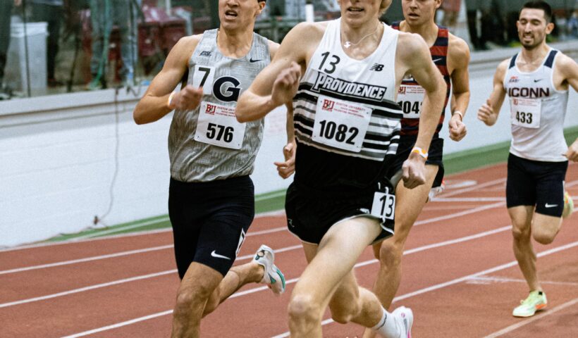 A group of men running on a track