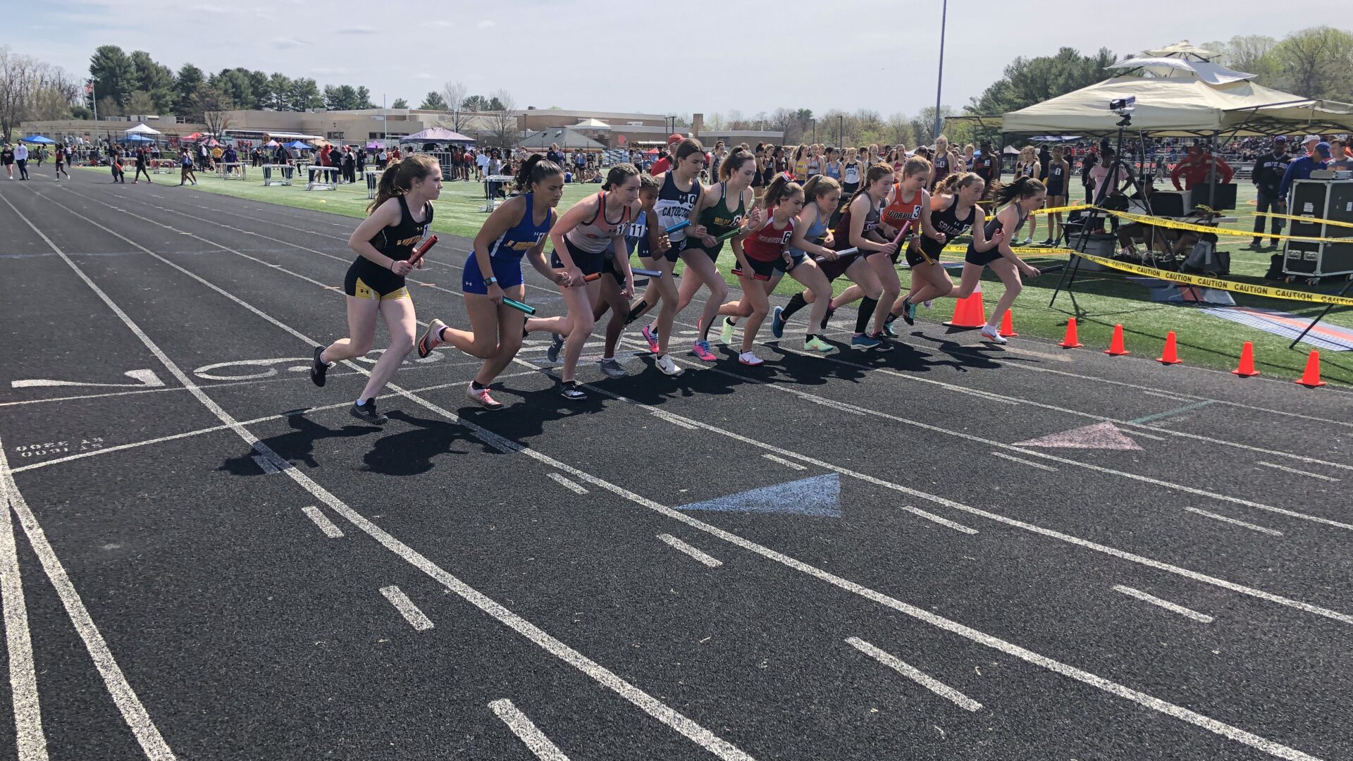 A group of people running on a track