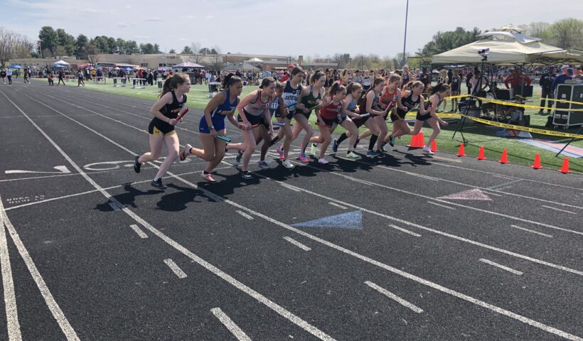 A group of people running on a track
