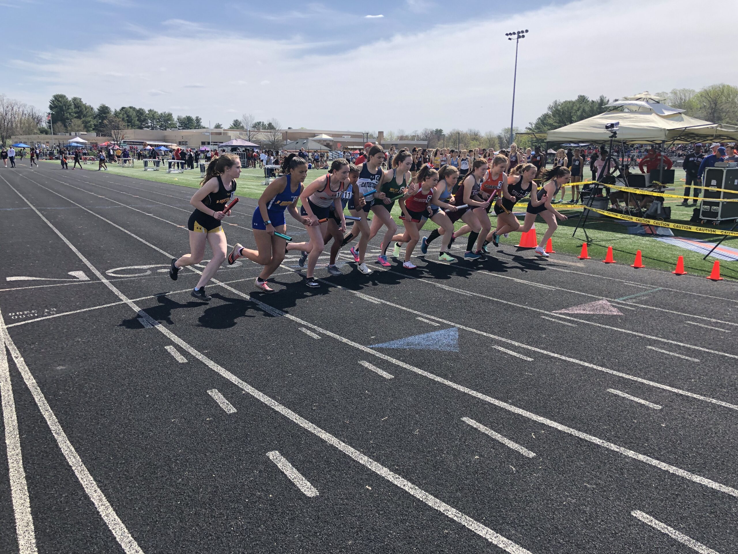 A group of people running on a track