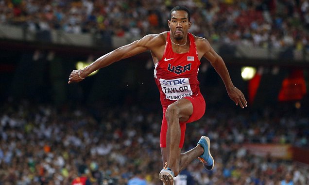 A man jumping in the air with his feet up.