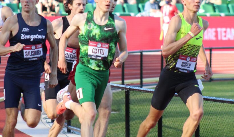 A group of men running on a track