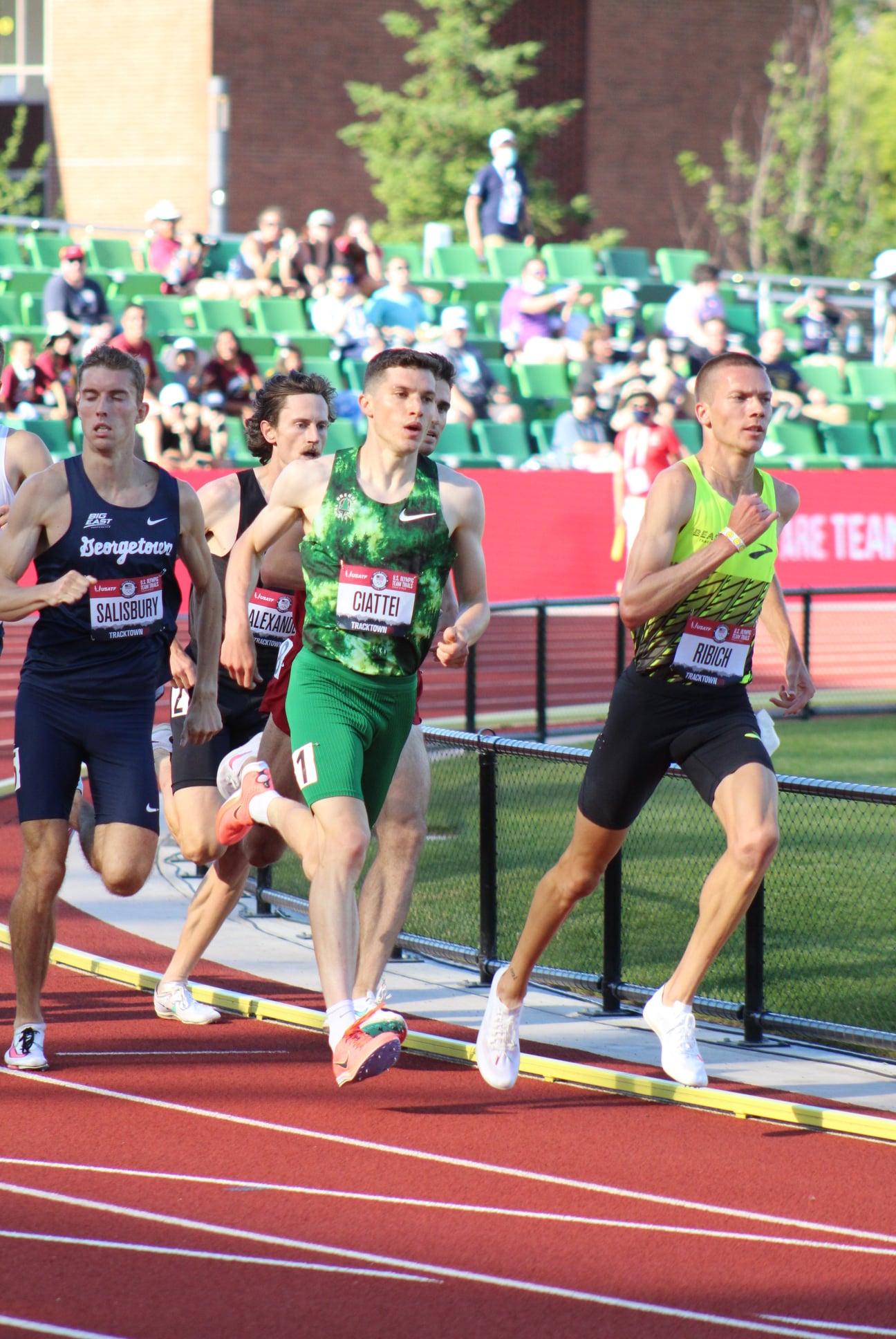 A group of men running on a track