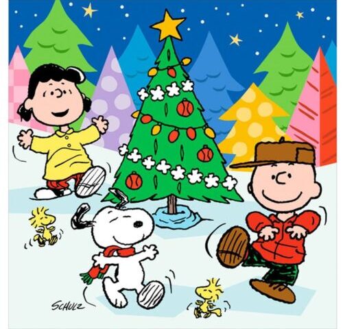 A group of peanuts characters standing around a christmas tree.
