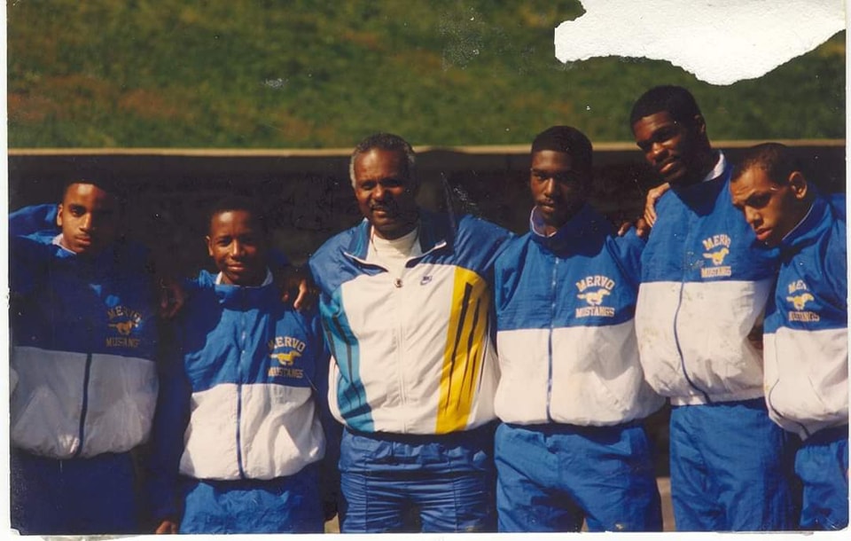 A group of young men standing next to each other.
