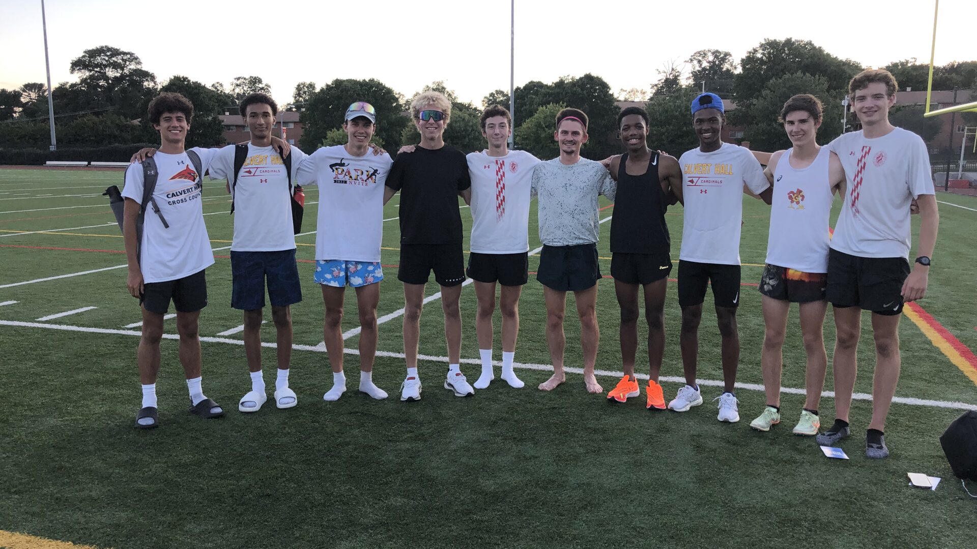 A group of men standing on top of a soccer field.