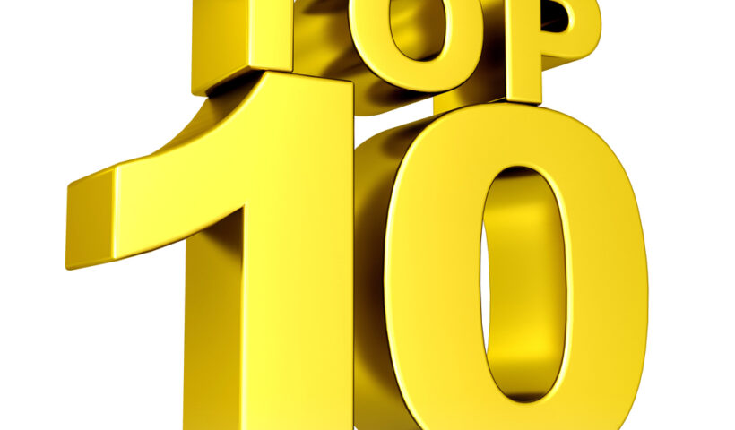 A gold top ten sign with the word " top 1 0 ".