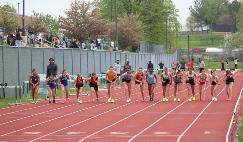 A group of people running on a track