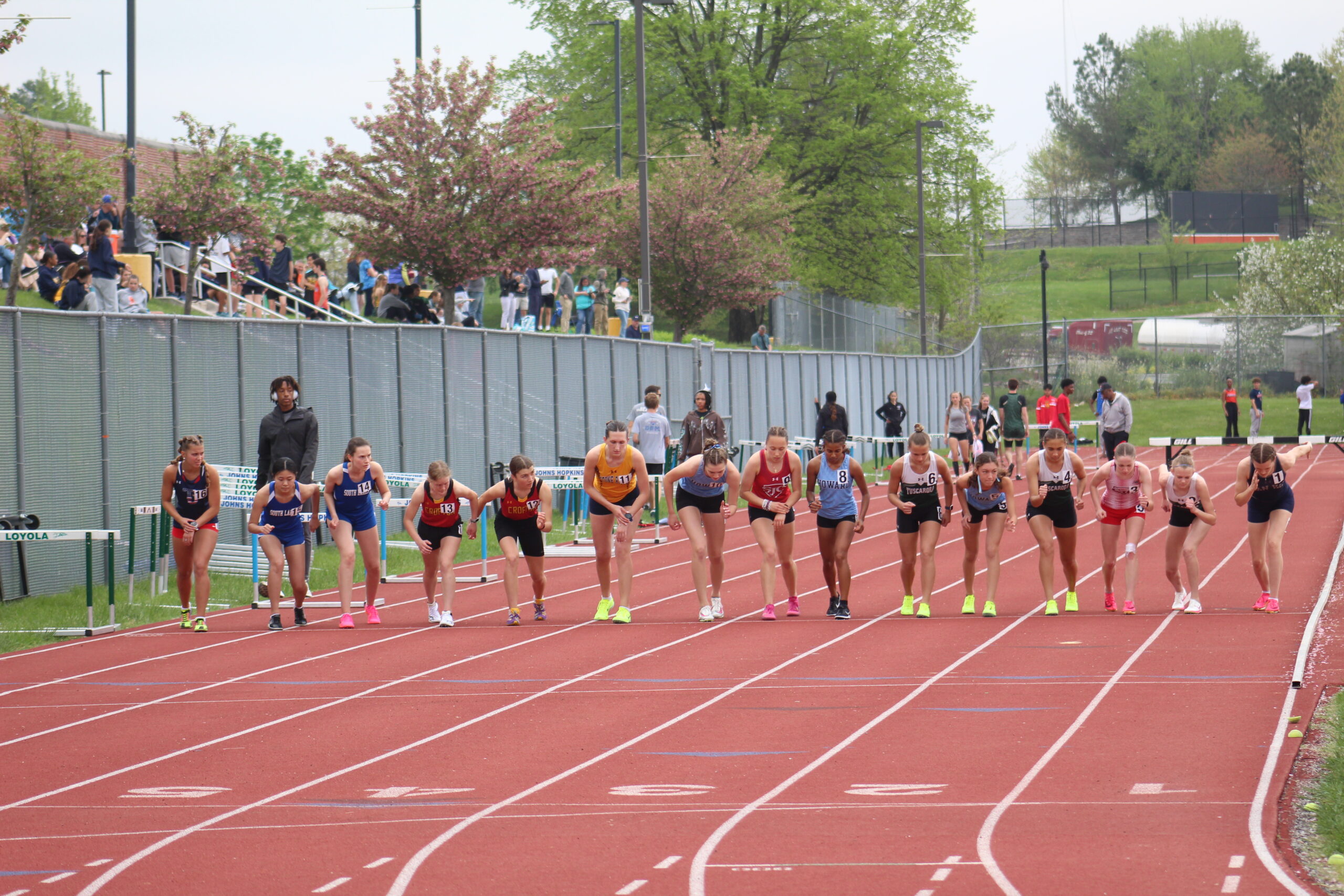 A group of people running on a track